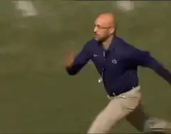 Joe Paterno running on field