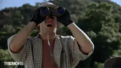 Man screaming through binoculars