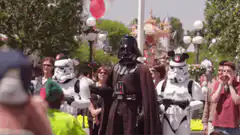 Darth Vader high fives a kid