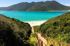wooden stairs to white sand beach
