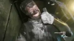 man covered in soot gives thumbs up