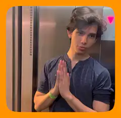Man in elevator with prayer hands