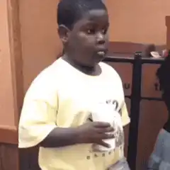 Young boy looking confused