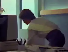 Woman shoots computer with rifle