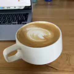 Latte art on wooden desk