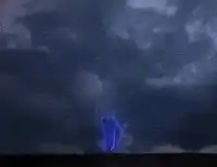 blue lightning bolt strikes ground