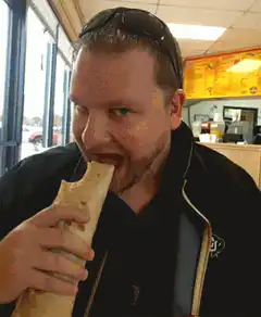 Man eating a burrito