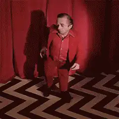 Kirk Douglas dancing in red suit