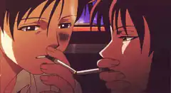 Two men sharing a cigarette