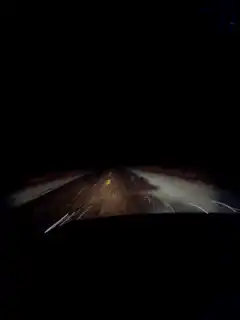 driving on a dark road at night