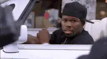 50 Cent in car looking confused then smiling