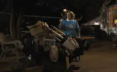 Woman burns furniture in yard