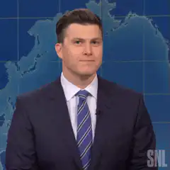 Colin Jost smirking