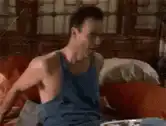 Jim Carrey laughing on a couch