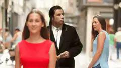 John Travolta looking at women