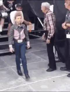 kid cowboy dancing have fun staying poor