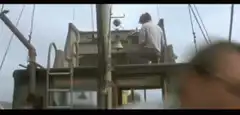 Arnold Schwarzenegger smoking on a boat