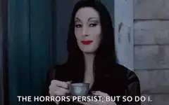 Morticia Addams sips tea
