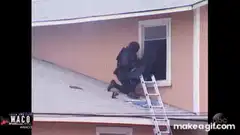 SWAT officer climbs through window