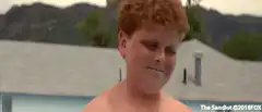 Squints throws water at girls