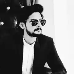 man in sunglasses and suit