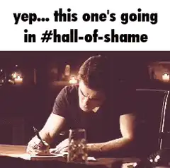 man writing in hall of shame