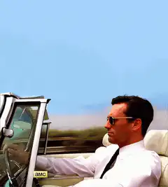 Don Draper driving a convertible