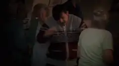 Man in sweater dancing at party