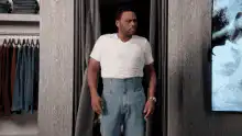 Man pulls up his jeans