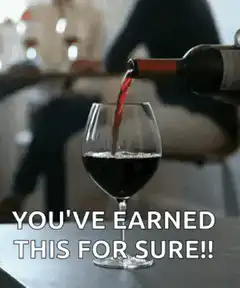 Red wine poured into glass with caption