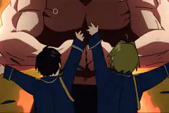 Two students push apart a giant's chest