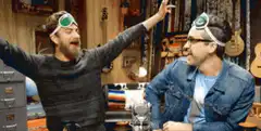 Sheldon and Leonard high five and hug