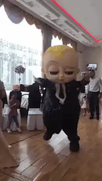 Boss Baby mascot dancing at event