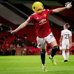 Manchester United player with duck head celebrating