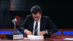 Stephen Colbert thumbs up papers
