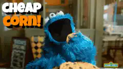 Cookie Monster eats popcorn
