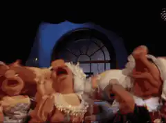 Muppets dancing in a room
