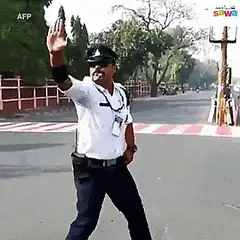 Indian traffic cop dancing in street