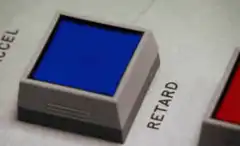 Finger presses blue button