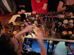 Bartender serves two cocktails