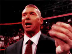 Vince McMahon counting money and celebrating