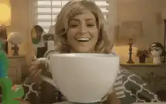 Woman drinking from giant mug