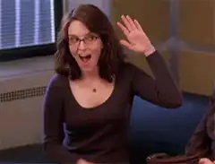 Tina Fey excitedly clapping
