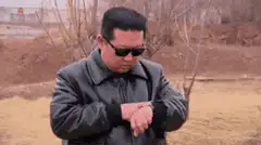Kim Jong Un and General checking watch