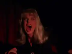 Woman screaming with purple lighting