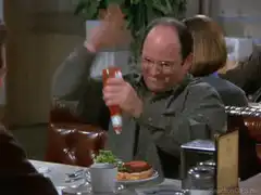 George Costanza shaking ketchup bottle