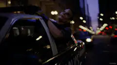 Joker laughing in police car
