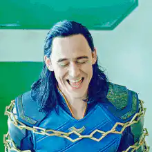 Loki laughing while chained