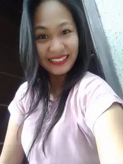 Smiling woman in pink shirt selfie