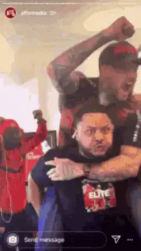 Man screaming with man on shoulders